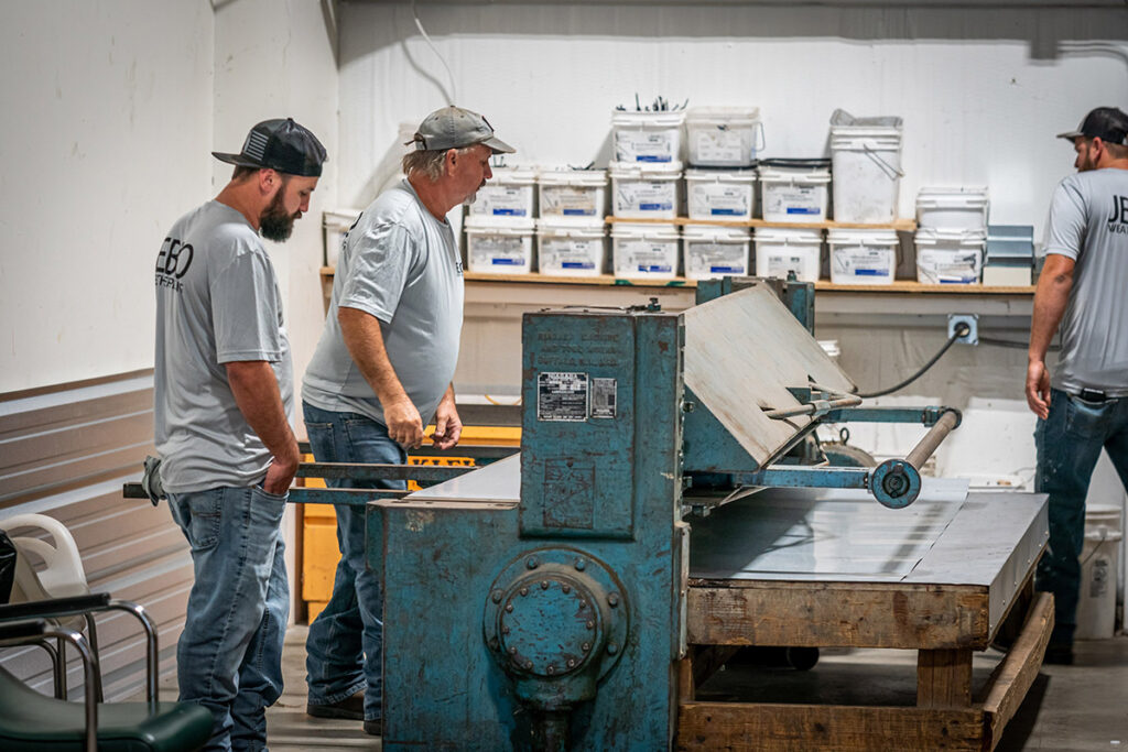 workers at a metal shear