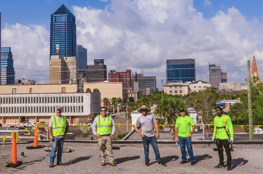 Jebco team standing on a roof