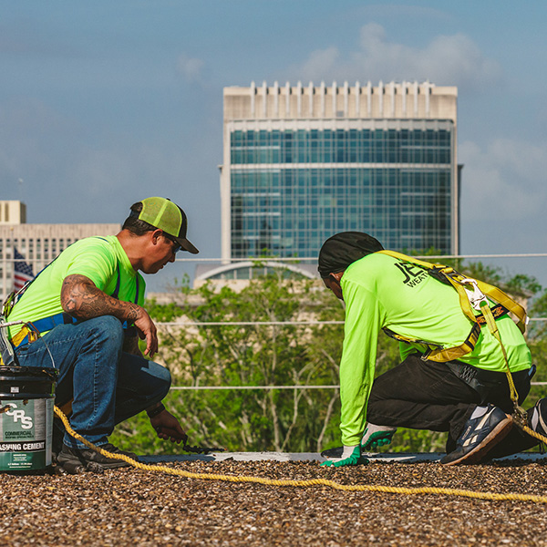Jebco employees working on a roof
